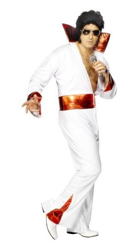 A man wearing a white Elvis-style costume with red accents, sunglasses, and holding a microphone.