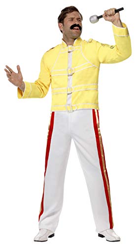 Man wearing a yellow military-style jacket, white trousers with red stripes, and holding microphone.