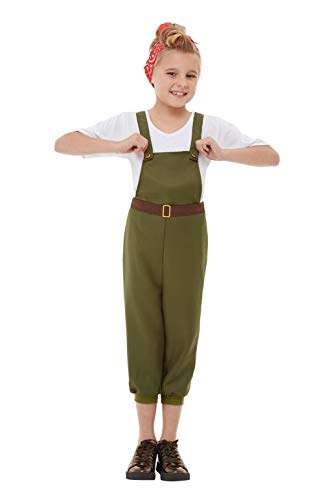 A girl wearing a white shirt, green overalls, and a red patterned headscarf.