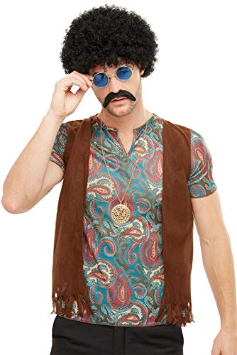 Man wearing a hippie costume with afro wig and round glasses.