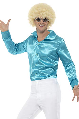 A man wearing a shiny blue long-sleeved shirt, white pants, blonde afro, and star-shaped glasses.