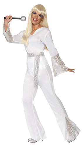 Woman in a white 1970s disco costume with flared trousers and microphone.