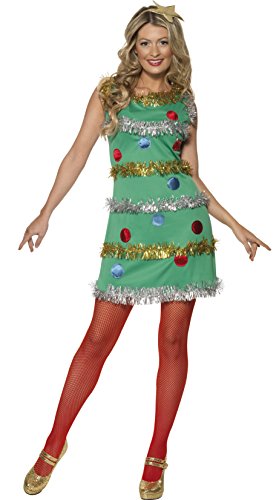 Woman wearing a green Christmas tree costume dress with ornaments, tinsel, and red tights.