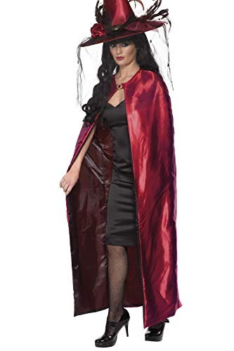 Woman wearing a long, red reversible cape and witch’s hat.