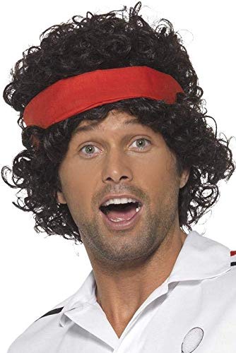 Man wearing a curly black wig and red headband.