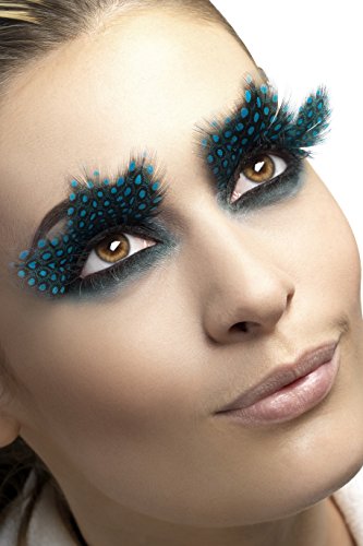 A woman wearing dramatic black and blue polka dot feather false eyelashes.