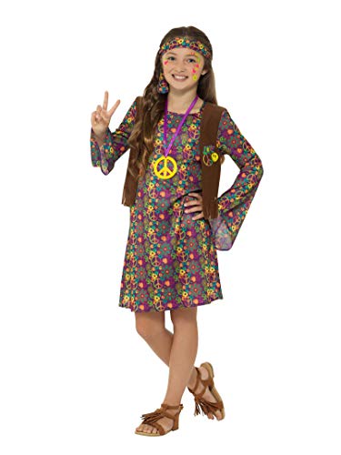 Girl in a floral dress, vest, and headband making a peace sign.