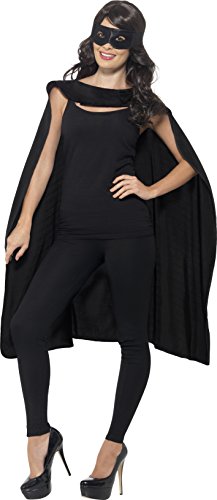 The image depicts a woman dressed in a black superhero costume. For accessibility purposes, a suitable alt text could be: "Woman wearing black superhero costume, mask, and cape."