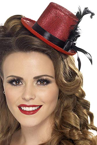 Red and black mini top hat with feather, worn on a woman’s head.