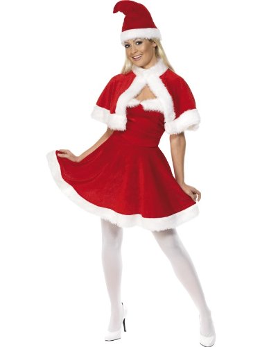 A woman wears a red and white Miss Santa costume, hat, and white tights and heels.