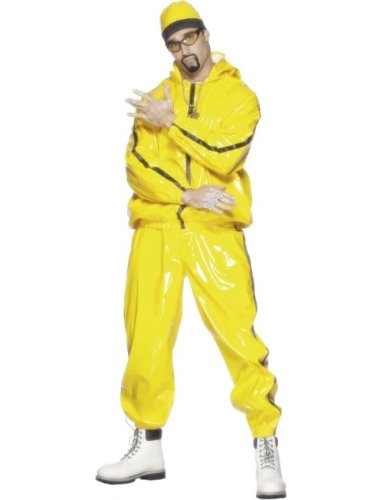 Man wearing a shiny yellow tracksuit, beanie, sunglasses, and white boots.