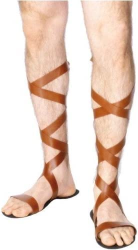 Brown leather Roman sandals wrapping around lower legs and feet.