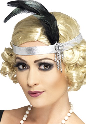 A woman wearing a silver headband with a black feather and jewel decoration.