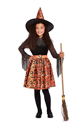 Young girl in an orange and black vintage-style witch costume.