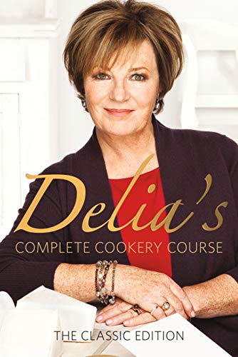 Delia Smith smiling on the cover of her book, Delia's Complete Cookery Course.