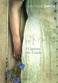 Book cover: woman in floral dress holding flowers, standing by wooden wall, with title and author.
