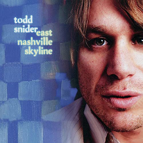 Close-up portrait of Todd Snider beside a blue textured background with album text.