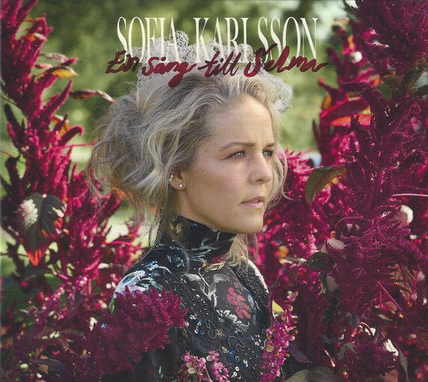 CD cover: Portrait of Sofia Karlsson surrounded by burgundy flowers.