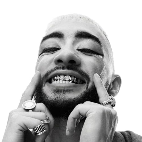 Black and white portrait of Sofiane Pamart with grillz and rings.