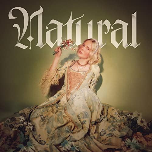 CD cover: woman in floral dress holding flowers, ornate title.