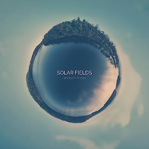A circular panoramic photo of a lake and forest with Solar Fields text overlay.