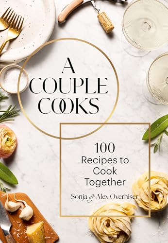 Cookbook cover with food, wine glasses, and text "A Couple Cooks.
