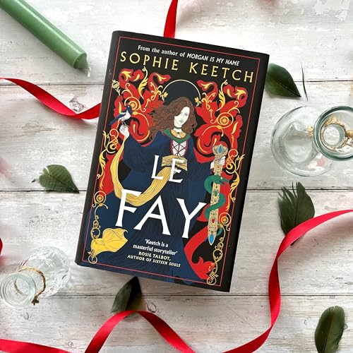 Book cover for “Le Fay” featuring a woman with long hair and ornate design.
