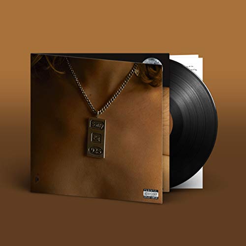 Vinyl record with album cover featuring a gold chain and torso.