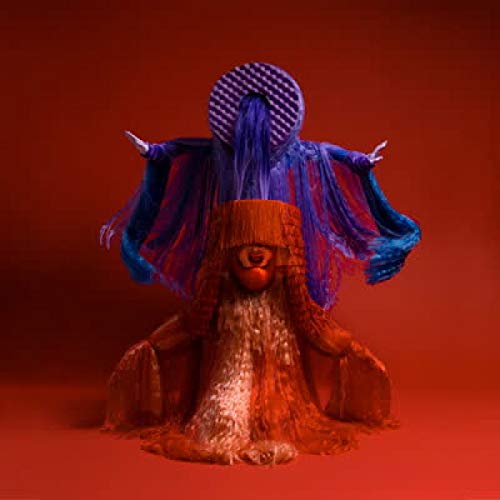 CD cover for "Origenes" by Sotomayor, featuring a masked figure in vibrant colors.
