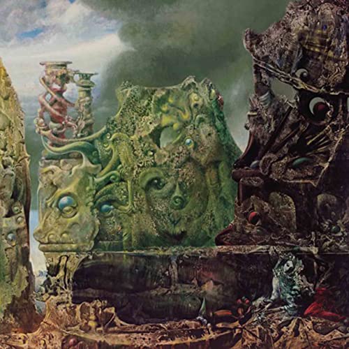 Album cover: ornate, decaying stone structures with a face detail.