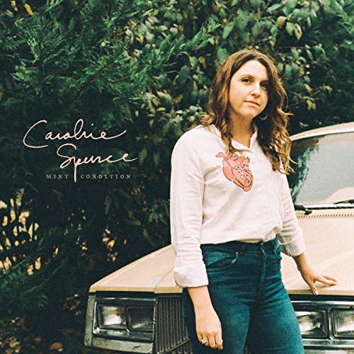 "Album cover featuring a woman leaning on a car with green foliage behind."