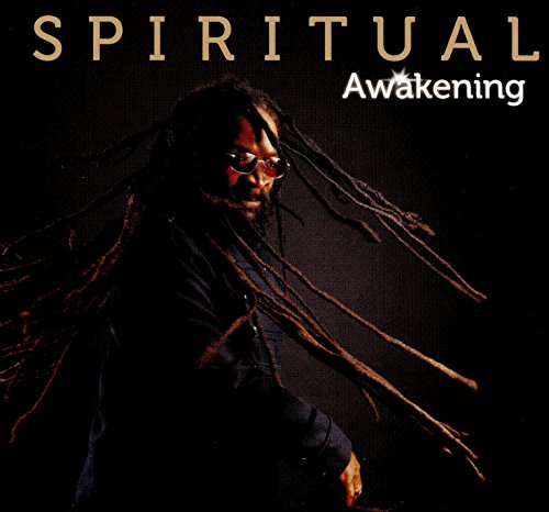 "Album cover with a man having long dreadlocks, wearing a dark jacket."