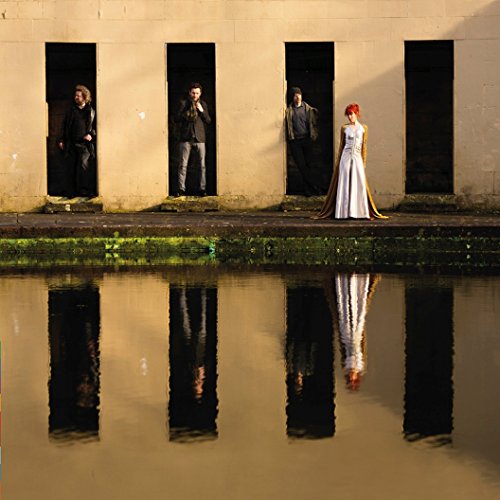 Four figures stand in arched openings reflected in still water.