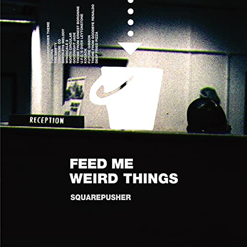 Album cover for Squarepusher’s “Feed Me Weird Things” featuring a glowing mug.