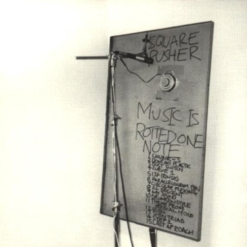 Squarepusher album cover: a grey, textured board with handwritten text and diagrams.