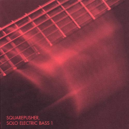 Red album cover for Squarepusher’s “Solo Electric Bass 1” with bass strings.