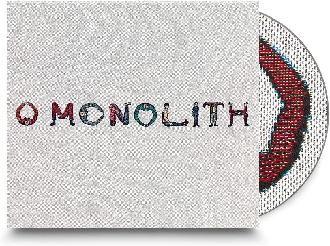 Squid’s “O Monolith” CD case with textured cover and visible disc.