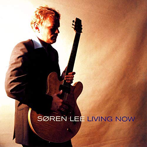 Søren Lee album cover featuring a man with a guitar, titled "Living Now".