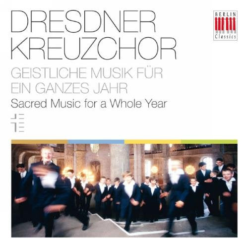 A CD cover featuring a choir in formal attire walking in a church.
