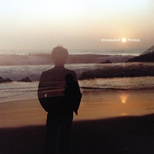 CD cover: silhouetted figure on a beach at sunset.