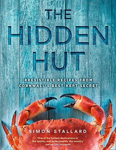 Cookbook cover with title, crab image, and weathered blue wood background.