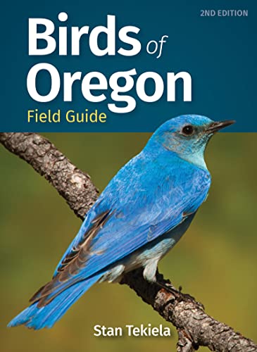 Birds of Oregon" field guide cover with a vibrant bluebird perched on a branch.