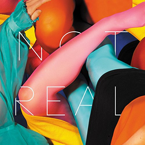 Colorful abstract album cover with the words "NOT REAL" overlaid.