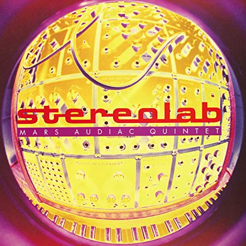Stereolab album cover: a yellow spherical structure with text overlay.