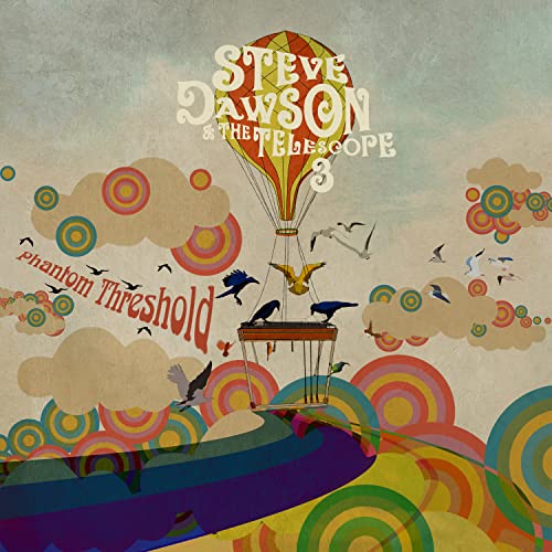A hot air balloon with a pedal steel guitar basket floats above colorful landscape patterns.