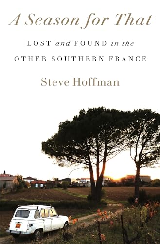Book cover showing a white car on a dirt road near trees at sunset.