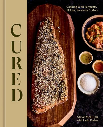 Cookbook cover featuring cured salmon, small dishes, and text “Cured”.