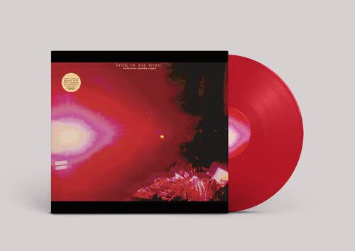 Red vinyl record with album cover featuring abstract red and purple imagery.
