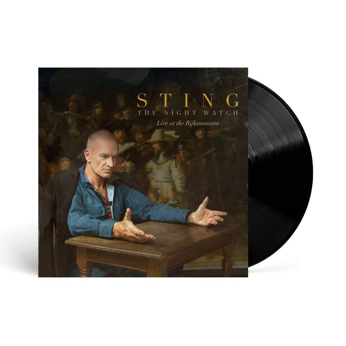 Sting sits at a table in front of The Night Watch painting on vinyl.