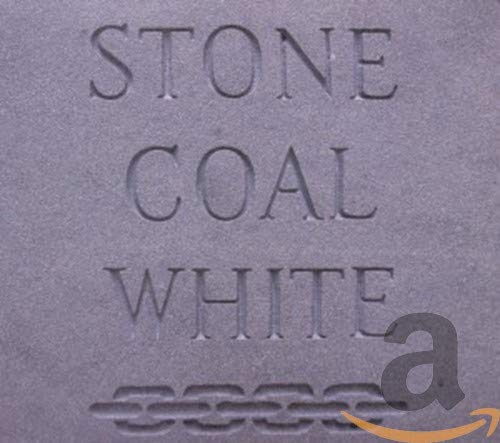 Close-up of textured gray surface with embossed "STONE COAL WHITE" text.